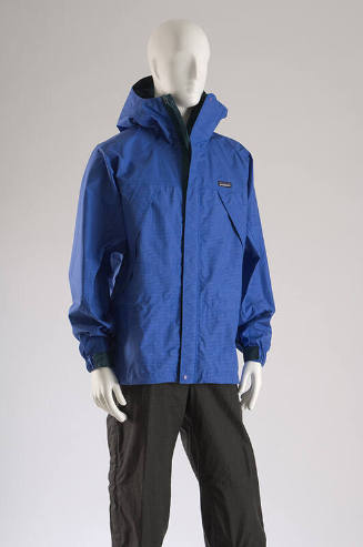 Blue nylon, hooded parka and zip/velcro front closure, black sport pants