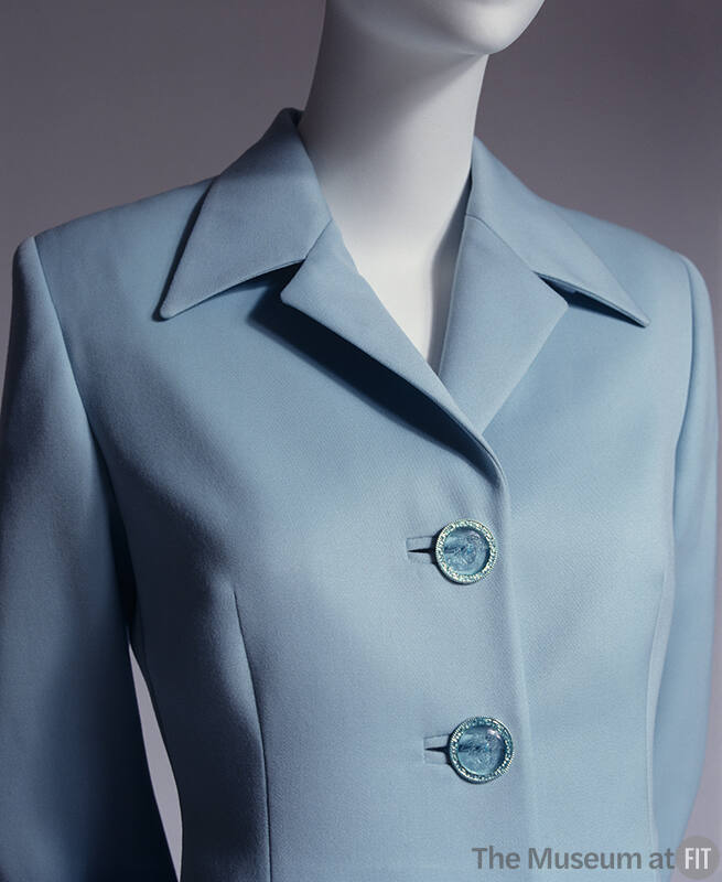 Light blue wool suit; large Medusa logo buttons