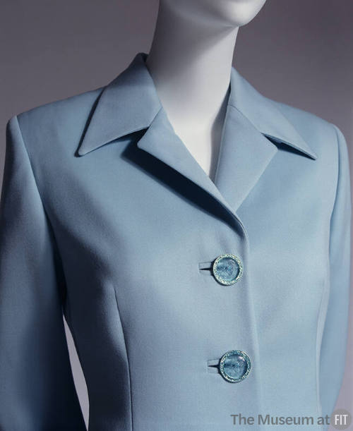 Light blue wool suit; large Medusa logo buttons