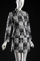 Fitted jacket and mini skirt with checkerboard pattern of black and white Mao portraits