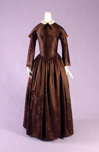 Brown day dress with floral patern, 3/4 length undersleeve with cap sleeve, and full skirt
