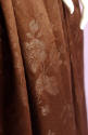Detail of brown floral pattern on brown dress