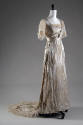 White silk silver lamé wedding dress with train and matching white silk satin shoes, both with …