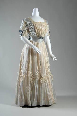 Two-piece, full length white gauze dress with lace and pale blue ribbon stripes and panels