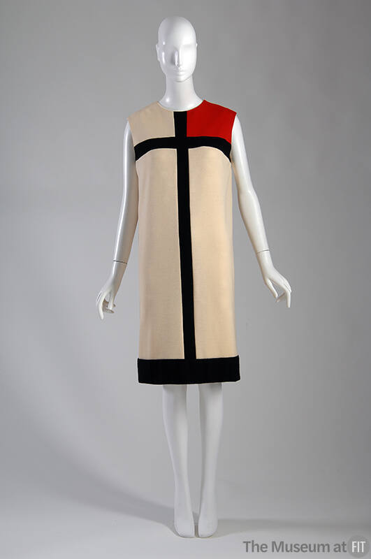 Mondrian dress: ivory wool dress with geometric black stripes and red color block at left shoul…