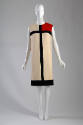 Mondrian dress: ivory wool dress with geometric black stripes and red color block at left shoul…