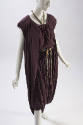 Purple top with side slits, matching skirt with drawstring waist and wrapped dhoti 

