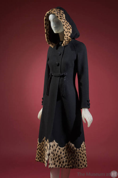 Black wool hooded coat with corded buttons and tassels, cheetah fur trim and shaped hem; matchi…