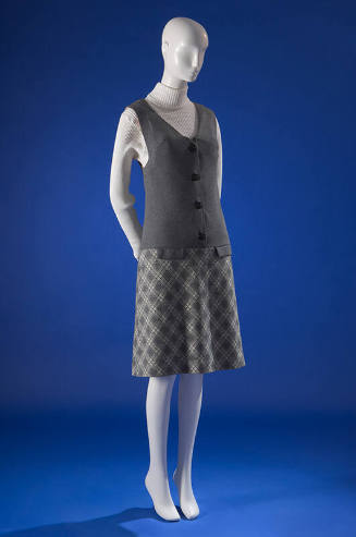 Drop-waist jumper grey dress with V-neck bodice and grey & white argyle knit A-line skirt 