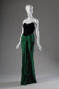 Strapless evening dress with black laced bodice and green floor-length wrap skirt 
