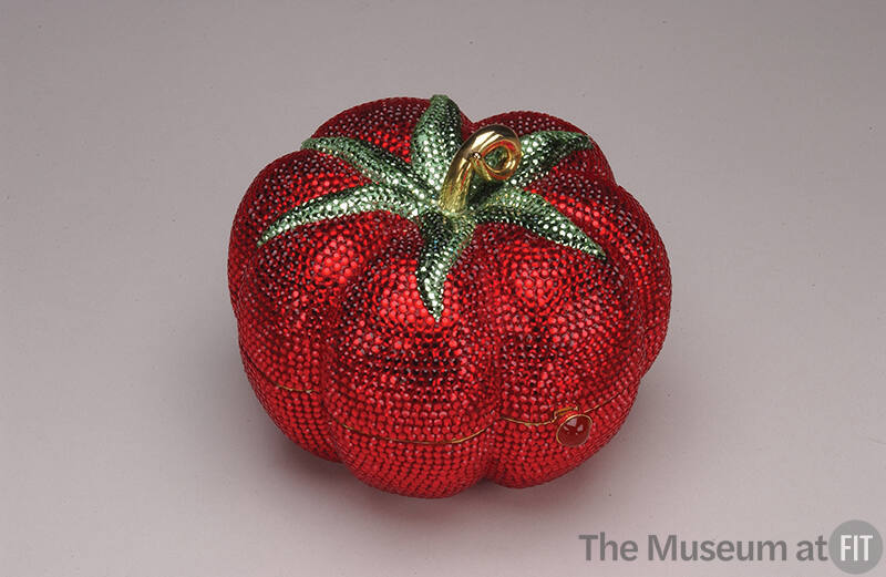 Red rhinestone tomato shaped minaudière with green rhinestone leaves and gold stem