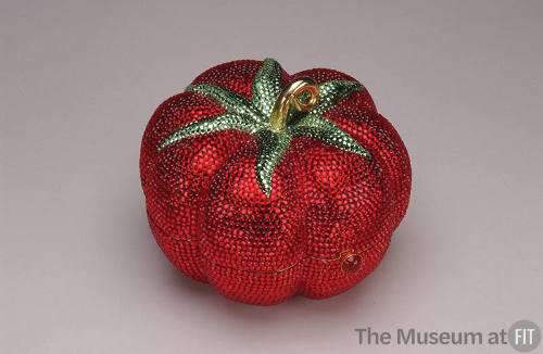 Red rhinestone tomato shaped minaudière with green rhinestone leaves and gold stem
