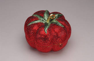 Red rhinestone tomato shaped minaudière with green rhinestone leaves and gold stem