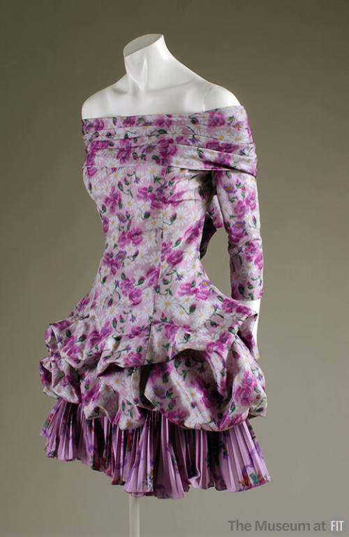 Purple floral off-the-shoulder mini dress with ¾ sleeves and pouf skirt over pleated flounce