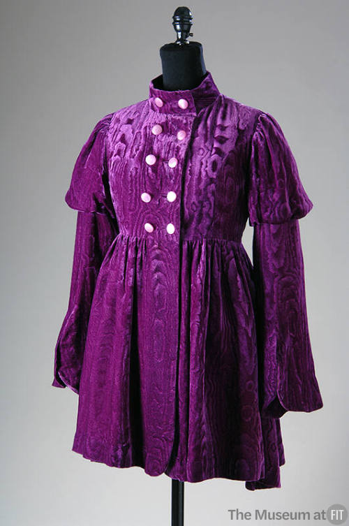 Purple velvet mini coat with watered design, double breasted bodice and bell sleeves with puffe…