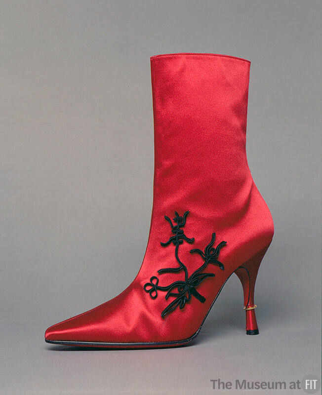 Red silk satin calf height evening boot with black Chinese style trim on outside vamp, pointed …