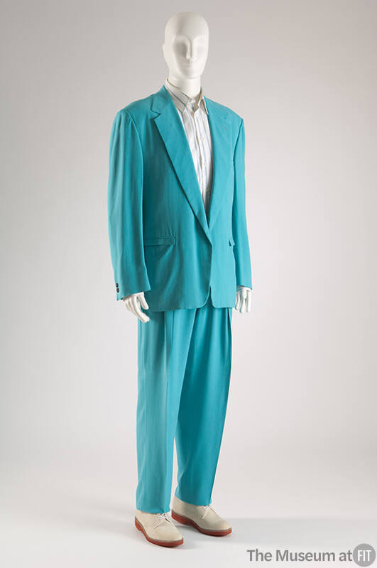 Man’s turquoise suit with single breasted jacket, tapered pants, white shirt with blue stripes …