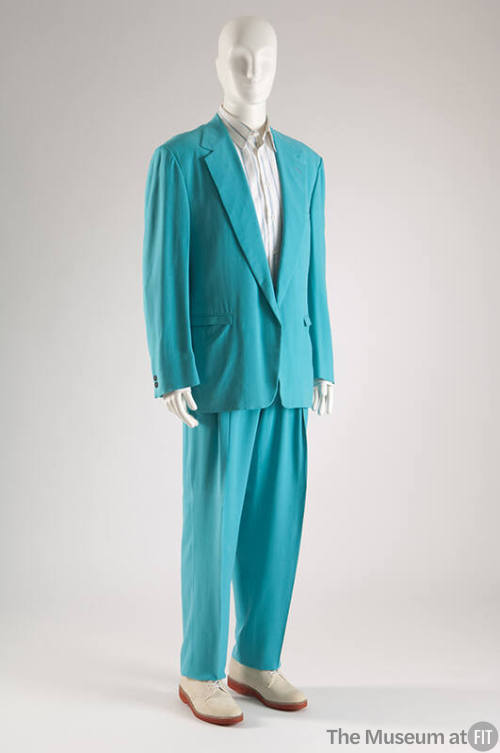 Man’s turquoise suit with single breasted jacket, tapered pants, white shirt with blue stripes …
