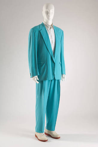 Man’s turquoise suit with single breasted jacket, tapered pants, white shirt with blue stripes …