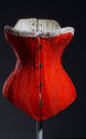 Red corset with white lace trim at top, white topstitching and metal bar and loop front closure…