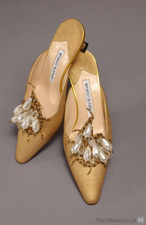 Pair of gold lizard skin mules with vamp ornaments of faux pearls, crystal teardrops and gold b…