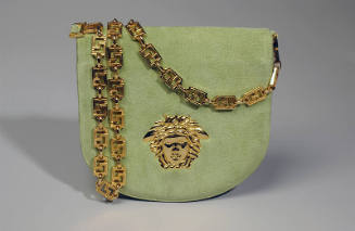 Chartreuse fold over shoulder bag with gold chain link strap and Versace Medusa logo on front