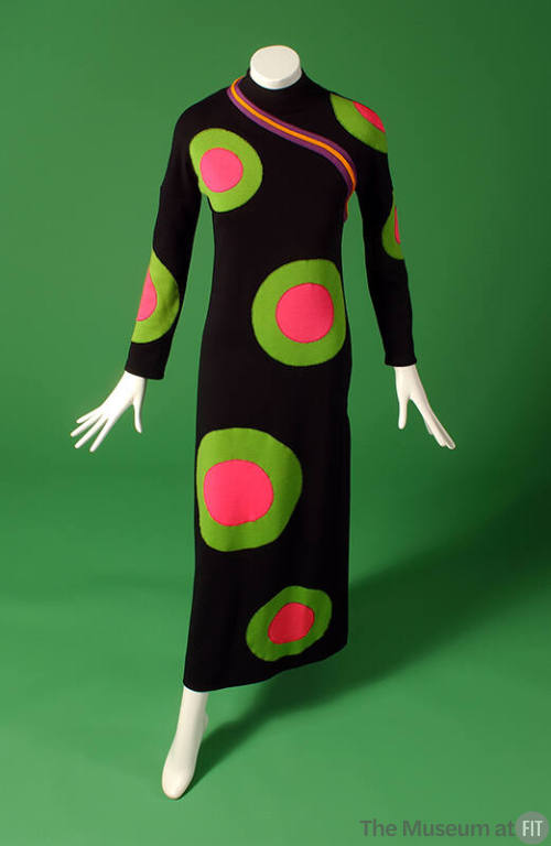 Black floor length long sleeve dress with large concentric hot pink and green circles throughou…