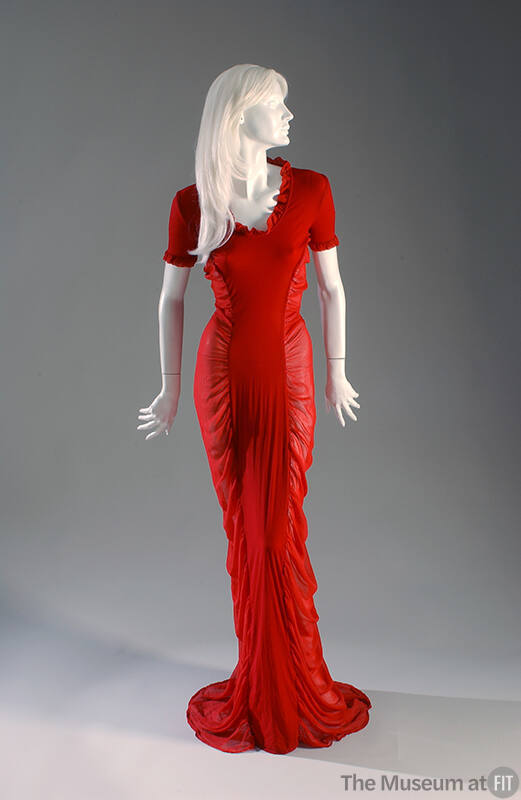 Red short sleeve floor length dress with sheer gathered sides and ruffle trim 