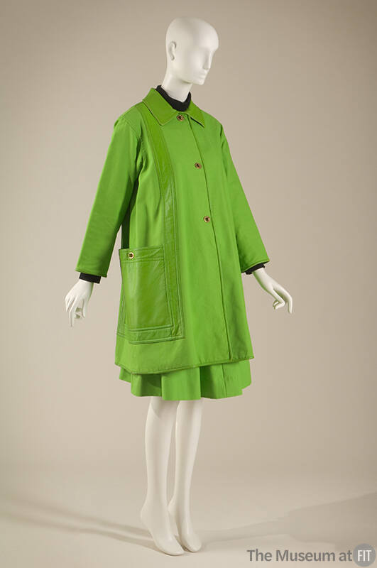 Green long sleeve jacket with leather collar, stripe and large patch pocket, brass buttons and …
