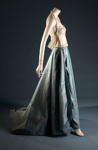 White halter neck bustier with beads over blue taffeta floor length skirt with train 