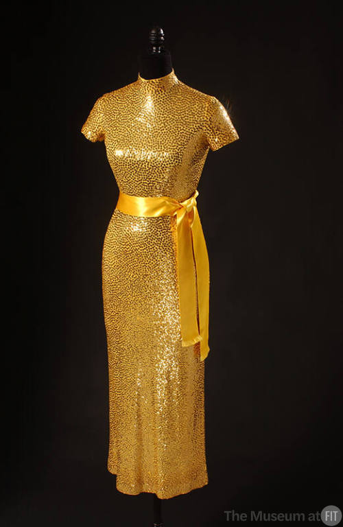 Allover gold sequinned short sleeve dress with gold satin sash belt