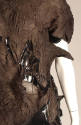 Detail of black crinkle fabric dress bodice with cut outs and shiny rubber
