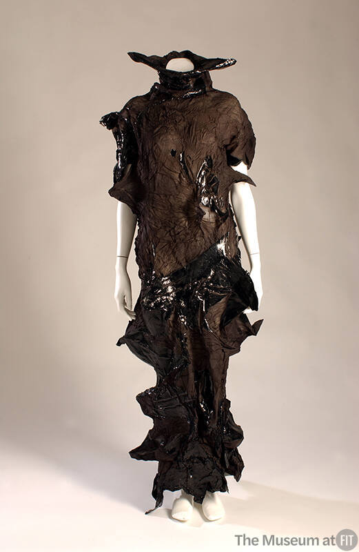 Black crinkle fabric dress with cut outs and shiny rubber details