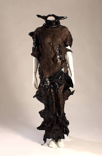 Black crinkle fabric dress with cut outs and shiny rubber details