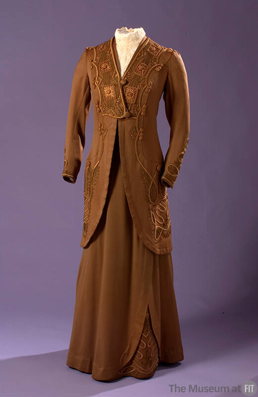 Brown embroidered long sleeve jacket and matching floor length skirt 