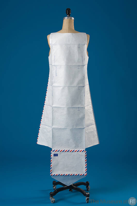 White paper dress made from unfolded air mail envelope with red, white, blue trim 