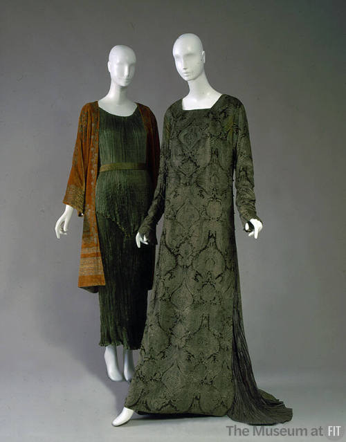 Left: green pleated dress with orange velvet coat with gold embroidery Right: Floor length long…