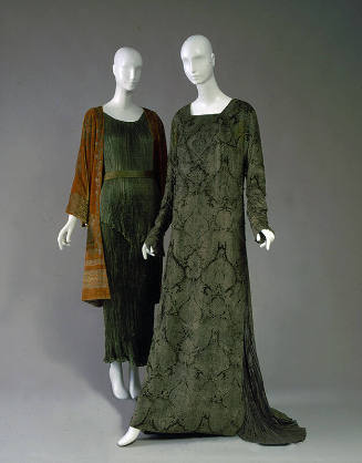 Left: green pleated dress with orange velvet coat with gold embroidery Right: Floor length long…