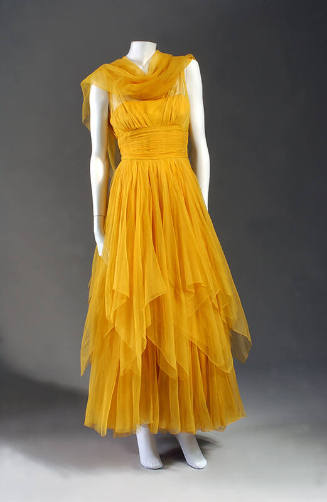 Orange silk chiffon ankle length dress with layered skirt and neck scarf 