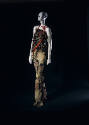 Camouflage halter evening dress with long asymmetrical and large orange plastic zippers for str…