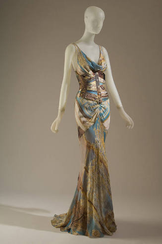 Long, flared evening dress and corset printed with design of gilt baroque frames and red string…