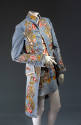18th century/1960s inspired ensemble: mini skirt embroidered with large floral border design; c…