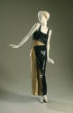 Long, black and beige sequined evening sheath with asymmetrical design