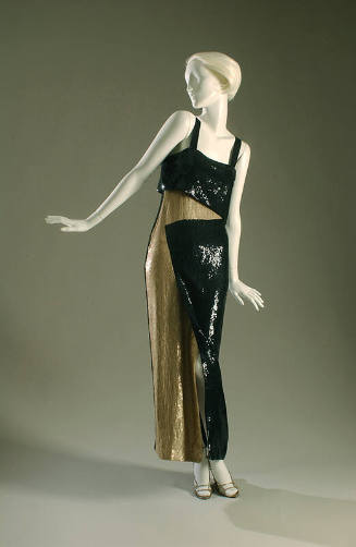 Long, black and beige sequined evening sheath with asymmetrical design