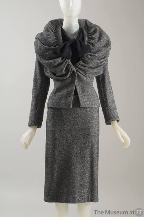 Black and white tweed with black sparkle suit: jacket with wide, voluminous shawl collar; strai…