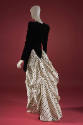 Black, long sleeved mini sheath cocktail dress; white with black polka dot train attached in la…