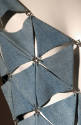 Blue denim asymmetrical openwork bodice linked with metal rings in diamond-grid