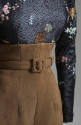 Detail of Chinoiserie blouse overbeaded with scattered black seed beads with floral pattern; ta…