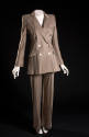 Taupe pantsuit with double breasted jacket with padded shoulders and wide leg cuffed trousers