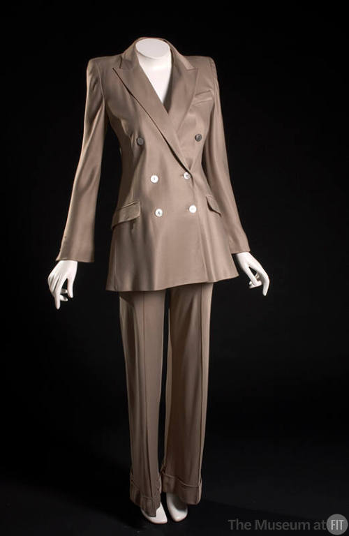 Taupe pantsuit with double breasted jacket with padded shoulders and wide leg cuffed trousers